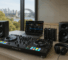 Full DJ gear setup in Australia with controller, mixer, headphones, speakers, and DJ software in a modern indoor environment.
